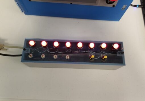 I/O Pushbutton Box overhead view with lighted buttons.